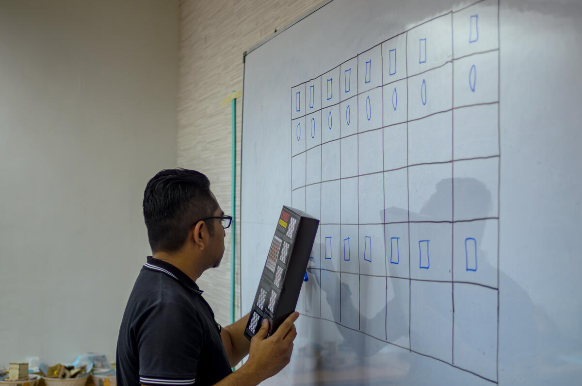 A pupil studying a chess position on the board