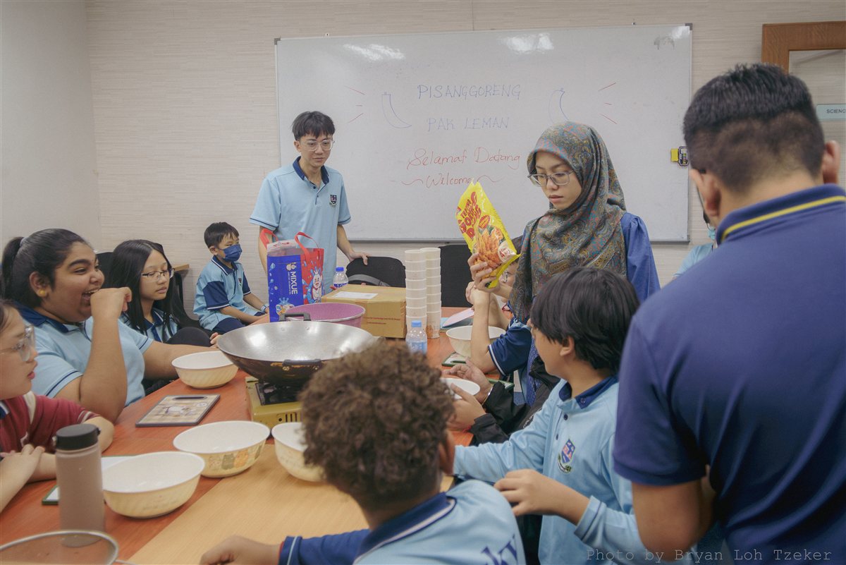 Pupils making goreng pisang in culinary class at Edusky Private School