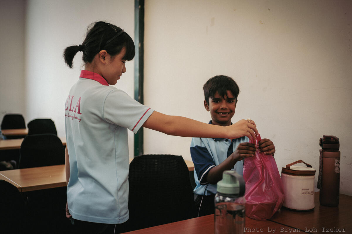 Pupils handing out food to their customers
