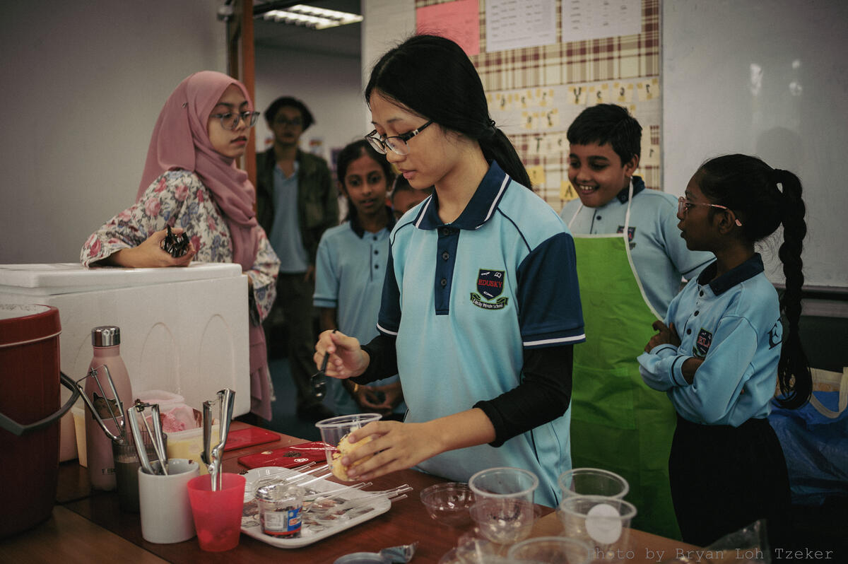 Year 6 pupils preparing drinks for their stall