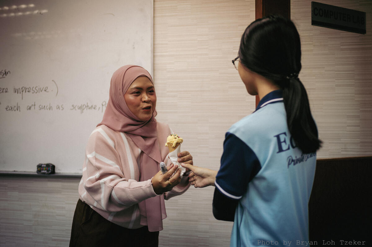 Pupils preparing food with teachers alongside