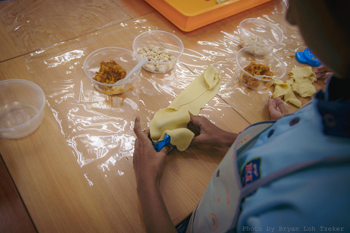 Nasi lemak packets with sambal and peanuts