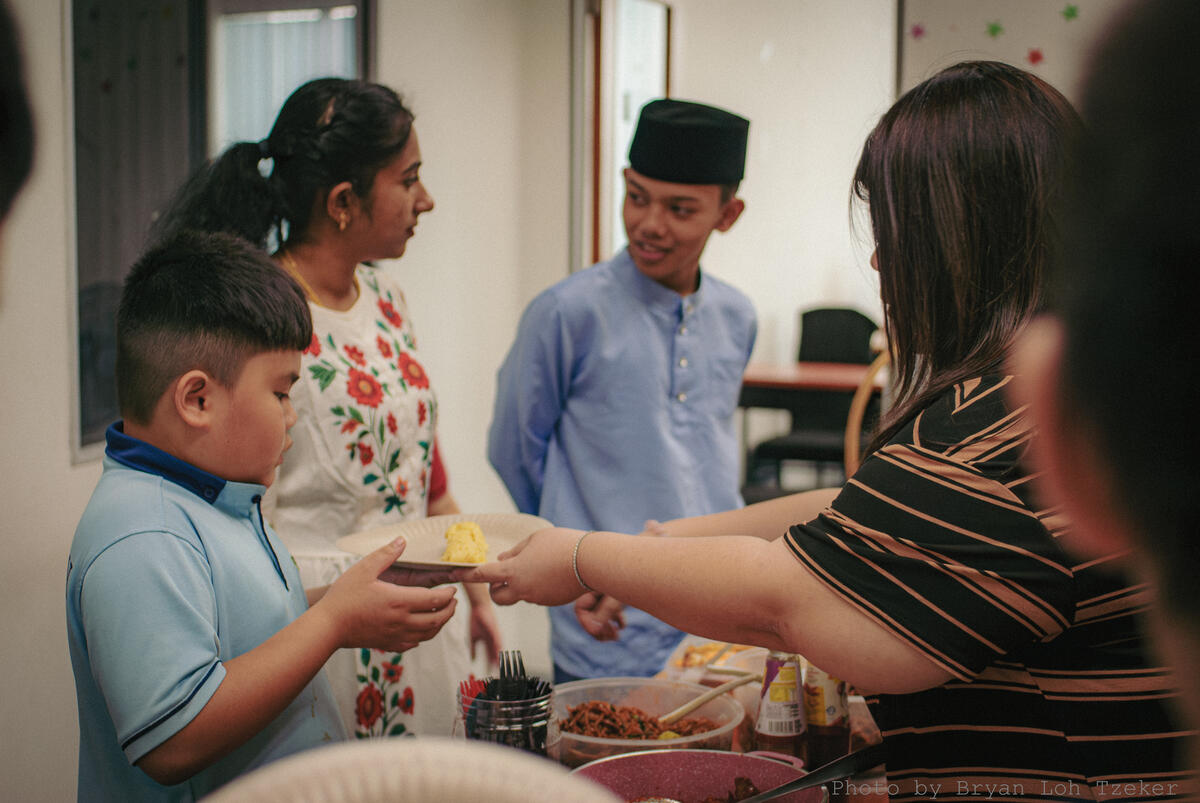 Classmates eating nasi lemak together at Merdeka