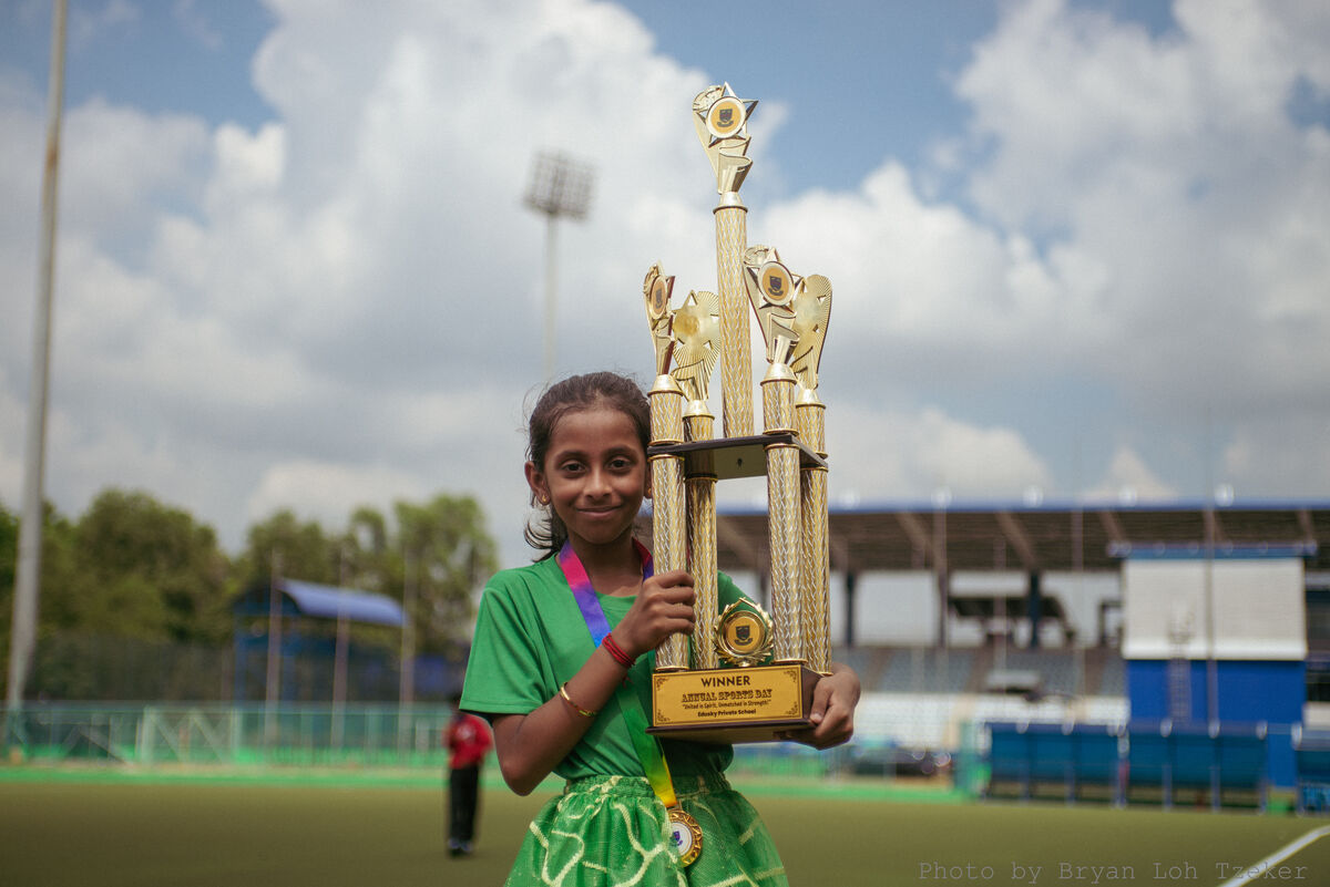 Studentposingwithtrophy-26