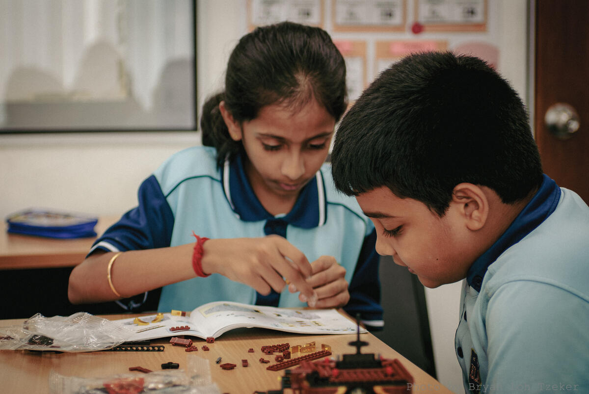 Year 3 pupils solving a building problem together