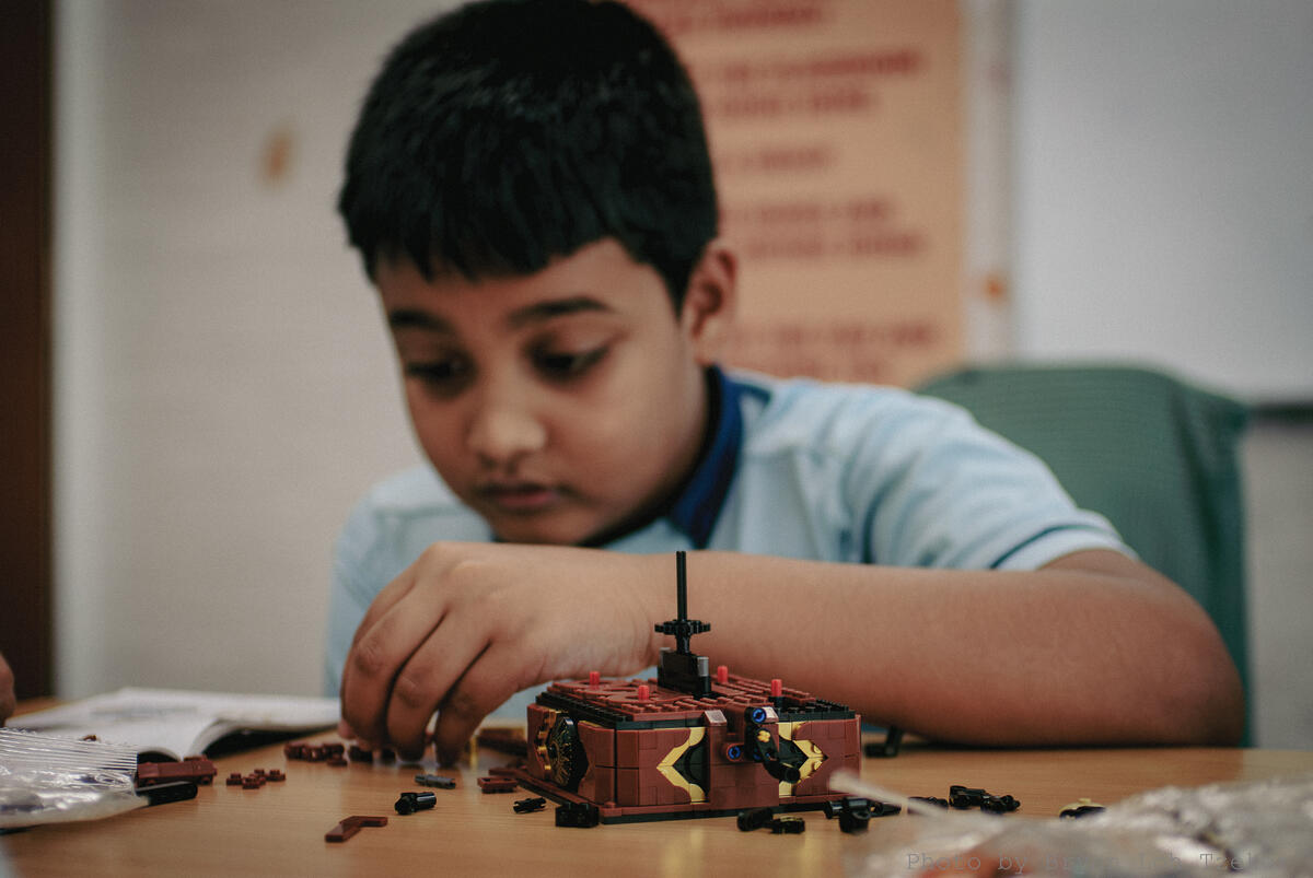 Pupils comparing their build to the instruction booklet