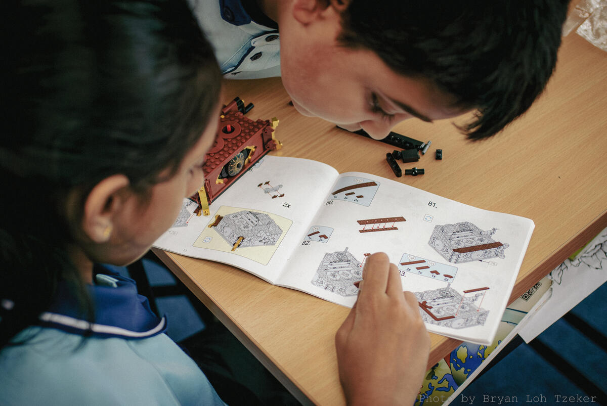 Pupils laying out Lego pieces before the next step
