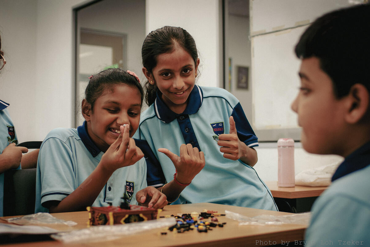 Pupils placing the finished Lego model on display